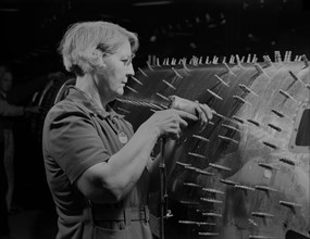 Female Worker Drilling Holes in B-17F (Flying Fortress), Heavy Bomber, Boeing, Seattle, Washington, USA, Andreas Feininger for Office of War Information, December 1942