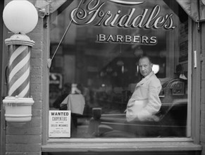 Portrait of Barber in Barber Shop Window, Help Wanted Sign Looking for Skilled Labor Resources Posted in Window by Virginia State Employment Service, Friddle's Barbers, Harrisonburg, Virginia, USA, Jo...