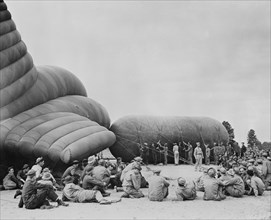 Trainees Sitting Around Instructor at Balloon Barrage Training Center, Camp Tyson, Tennessee, USA, Office of War Information, early 1940's