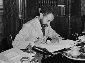 Haile Selassie (1892-1975), Emperor of Ethiopia, Portrait Writing Letter to U.S. President Franklin Roosevelt Upon his Return to Addis Ababa, Ethiopia after Allied Defeat of Italian Fascist Occupation...