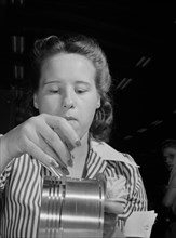 Anne Weinman, 22 years old, Inspecting Pistons to be used in Military Aircraft Engines at Buick Plant Converted for War Product Production, Melrose Park, Illinois, USA, Ann Rosener, Office of War Info...