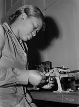 Mignon Gunn, Female Factory Worker, Reconditioning used Spark Plugs to be re-used in Testing Military Aircraft Motors at Buick Plant Converted for War Product Production, Melrose Park, Illinois, USA, ...