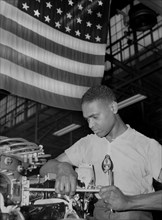 Zed W. Robinson, Factory Worker, Tightening Bolts of Cylinder Barrel during Final Build-up of Airplane Engine at Buick Plant Converted for War Product Production, Melrose Park, Illinois, USA, Ann Rose...