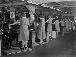 Row of Female Factory Workers Operating Machinery at Drill and Tool Plant that Manufactures Drills for use in all War Production Industries, Republic Drill and Tool Company, Chicago, Illinois, USA, An...