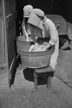 Two Women Washing Clothes, Crabtree Recreational Project, near Raleigh, North Carolina, USA, Carl Mydans for U.S. Resettlement Administration, March 1936