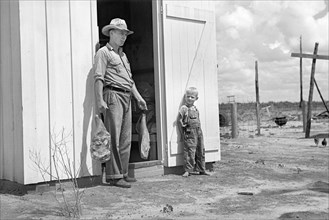 Mr. Foster with Home-Cured Meat, Irwinville Farms Project, Irwinville, Georgia, USA, John Vachon for Farm Security Administration, May 1938