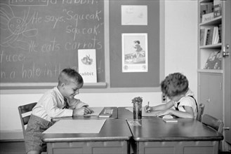 Two Young Boys Drawing at Desks in Classroom, Greenhills, Ohio, USA, a Greenbelt Community Constructed by U.S. Department of Agriculture as Part of President Franklin Roosevelt's New Deal, John Vachon...