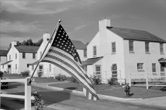 American Flag, Labor Day, Greendale, Wisconsin, USA, a Greenbelt Community Constructed by U.S. Department of Agriculture as Part of President Franklin Roosevelt's New Deal, John Vachon for U.S. Resett...