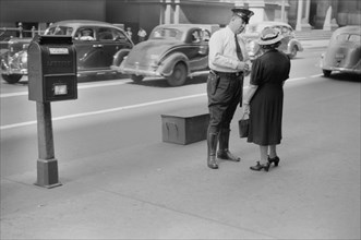Woman Talking to Policeman, Chicago, Illinois, USA, John Vachon for Farm Security Administration July 1940