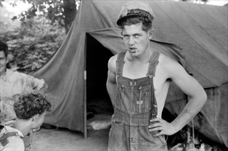 Migrant Worker in front of Tent Home, Berrien County, Michigan, USA, John Vachon for Farm Security Administration July 1940
