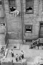 High Angle View of Children in Urban Backyard, Slums, Pittsburgh, Pennsylvania, USA, Arthur Rothstein for Farm Security Administration, July 1938