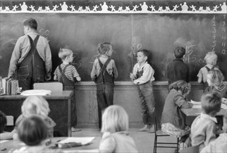 Children of Migratory Workers in Elementary School Classroom at FSA Camp, Weslaco, Texas, USA, Arthur Rothstein for Farm Security Administration, February 1942