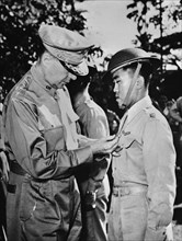 U.S. General Douglas MacArthur (left) Pinning Distinguished Service Cross on Captain Jesus A. Villamor of the Philippine Air Force for Heroism in the Air, Manila, Philippines, Office of War Informatio...