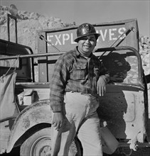 Portrait of Worker that Transports and Dispenses Explosive used for Blasting at Large Copper Mining Operation, which Supplies Great Quantities of Copper so vital to War Effort, Phelps-Dodge Mining Com...