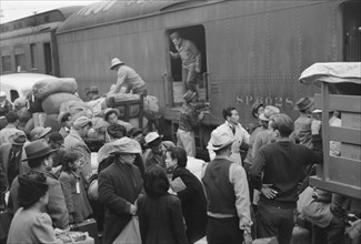 Japanese-Americans Gathering around Baggage Car During Evacuation of Japanese-Americans from West Coast Areas under U.S. Army War Emergency Order, Los Angeles, California, USA, Russell Lee, Office of ...