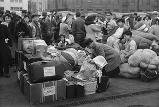 Japanese-Americans with Baggage Waiting for Train to Owens Valley During Evacuation of Japanese-Americans from West Coast Areas under U.S. Army War Emergency Order, Los Angeles, California, USA, Russe...