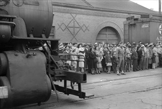 Japanese-Americans Waiting for Train to Owens Valley During Evacuation of Japanese-Americans from West Coast Areas under U.S. Army War Emergency Order, Los Angeles, California, USA, Russell Lee, Offic...