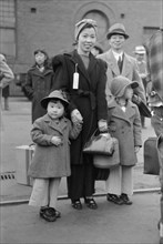 Japanese-American Mother and Daughter Waiting for Train to Owens Valley During Evacuation of Japanese-Americans from West Coast Areas under U.S. Army War Emergency Order, Los Angeles, California, USA,...