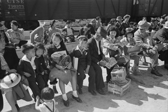 Japanese-Americans Waiting for Registration at Reception Center During Evacuation of Japanese-Americans from West Coast Areas under U.S. Army War Emergency Order, Santa Anita, California, USA, Russell...