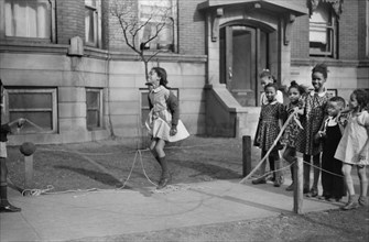 Group of Girls Jumping Rope on Sidewalk, "Black Belt" Neighborhood, Chicago, Illinois, USA, Edwin Rosskam for Office of War Information, April 1941
