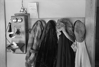 Telephone and Coats on Rack, Tenant Farmer's Farmhouse, Dickens, Iowa, USA, Russell Lee, U.S. Resettlement Administration, December 1936