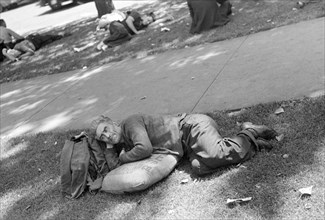 Man Resting on Sack of Seed in Park, Minneapolis, Minnesota, USA, Russell Lee, U.S. Resettlement Administration, August 1937