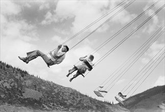 Two People on Amusement Park Ride, Labor Day Celebration, Silverton, Colorado, USA, Russell Lee, Farm Security Administration, September 1940