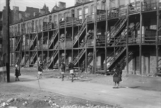Rear View of Apartment Houses with Wood Staircase, South Side, Chicago, Illinois, USA, Russell Lee, Farm Security Administration, April 1941