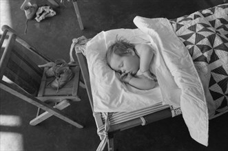 Child Napping at Nursery School, FSA Farm Workers Community, Woodville, California, USA, Russell Lee, Farm Security Administration, March 1942