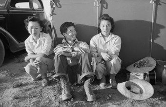 Japanese-American Farm Worker's Family outside near their Tent, Farm Security Administration (FSA) Mobile Camp, Nyssa, Oregon, USA, Russell Lee, Farm Security Administration, July 1942