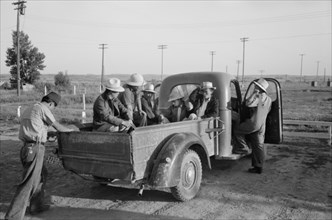 Farmer's Truck at Farm Security Administration (FSA) Mobile Camp to Pick up Japanese-American Farm Workers Living there, Nyssa, Oregon, USA, Russell Lee, Farm Security Administration, July 1942