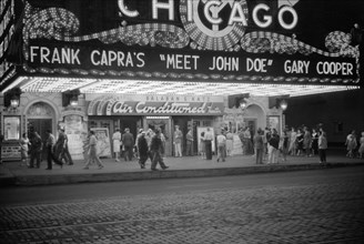 Crowd and Movie Theater Marquee at Night, Chicago, Illinois, USA, John Vachon, Farm Security Administration, July 1941