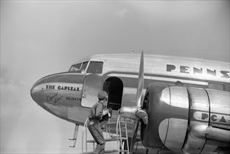 Loading Baggage onto Airplane, Municipal Airport, Washington DC, USA, by Jack Delano, Farm Security Administration, July 1941