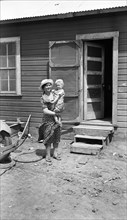 Typical Teutonic Farm Wife and Child, Client for Resettlement, Mills, New Mexico, USA, Dorothea Lange, Farm Security Administration, May 1935