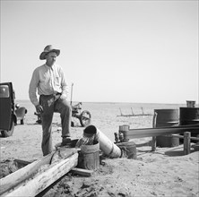 Farmer Pumping Water from Well to Parched Fields during Drought, Cimarron County, Oklahoma, USA, Arthur Rothstein, Farm Security Administration, April 1936