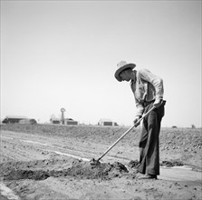 Farmer Fighting Drought and Dust with Irrigation, Cimarron County, Oklahoma, USA, Arthur Rothstein, Farm Security Administration, April 1936
