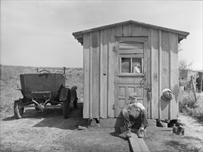 Worker in Strip Coal Mine Sitting in front of Home, Cherokee County, Kansas, USA, Arthur Rothstein, Farm Security Administration, May 1936