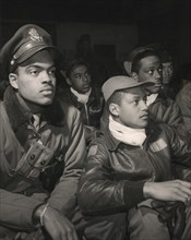 Members of 332nd Fighter Group Attending a Briefing, from left to right: Robert W. Williams, Ottumwa, IA, Class 44-E; William H. Holloman, III, St. Louis, Mo., Class 44; Ronald W. Reeves, Washington, ...