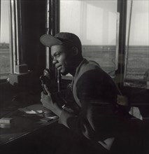 Sgt. William P. Bostic, 301st F.S. in Air Base Control Tower, Ramitelli, Italy, Toni Frissell, March 1945