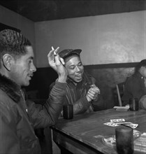 Tuskegee Airmen Playing Cards in Officers' Club, left to right: Walter M. Downs, New Orleans, LA, Class 43-B and William S. Price, III, Topeka, KS, Class 44-C, Ramitelli, Italy, Toni Frissell, March 1...