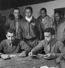 Tuskegee Airmen Playing Cards in Officers' Club, Seated, left to right: Robert Spurlock, Washington, DC; Harold M. Morris, Seattle, WA, Class 44-D