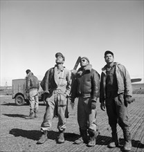 Three Tuskegee Airmen looking Up at Air Base, Ramitelli, Italy, Toni Frissell, March 1945