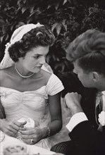 Jacqueline Bouvier Kennedy and Senator John F. Kennedy Talking at their Wedding Reception, Newport, Rhode Island, USA, by Toni Frissell, September 12, 1953