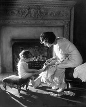 Mother Counting Child's Toes, circa 1915