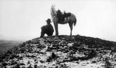 Lone Cowboy with his Horse, circa 1910