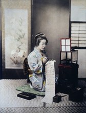 Japanese Women Writing a Letter, Hand Colored Albumen Photograph