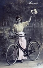 Woman Standing with Bicycle, Hand Colored Photograph, circa 1913