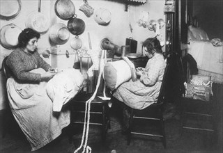 Mother and Daughter Making Pillow Lace in Tenement Apartment, New York City, USA, circa 1911