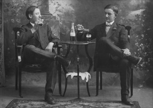 Two Seated Men Drinking Beer, USA, circa 1895
