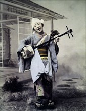 Girl with Samisen or Gozenobo, Hand Colored Albumen Photograph, circa 1880